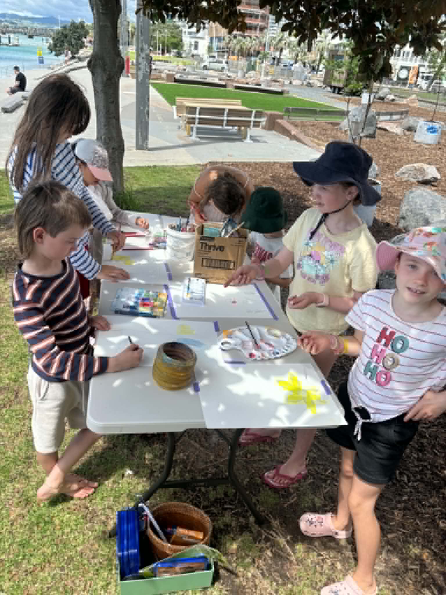 Children gathered for an outdoor art workshop in the park